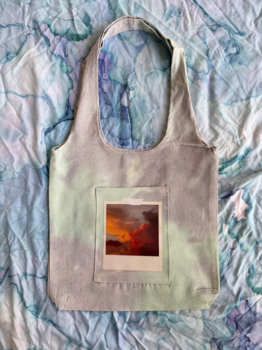Where Clouds Collide Tote Bag